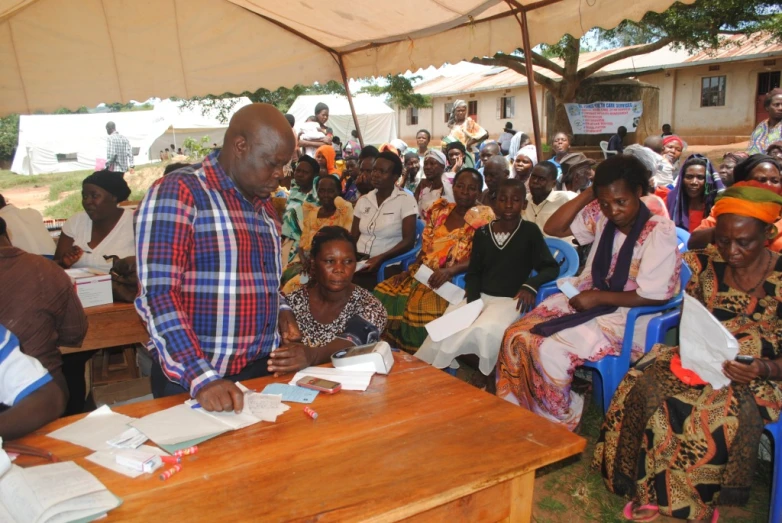 people at an event in various country are listening to the presenter