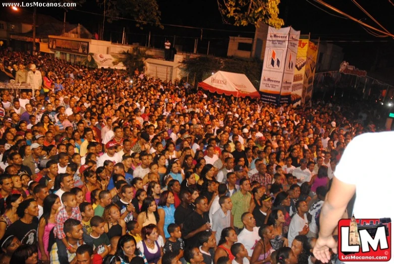 a man standing in front of an large crowd of people