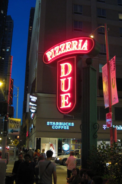 a red lighted sign in front of a building