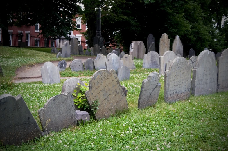 a bunch of headstones sitting in a cemetery