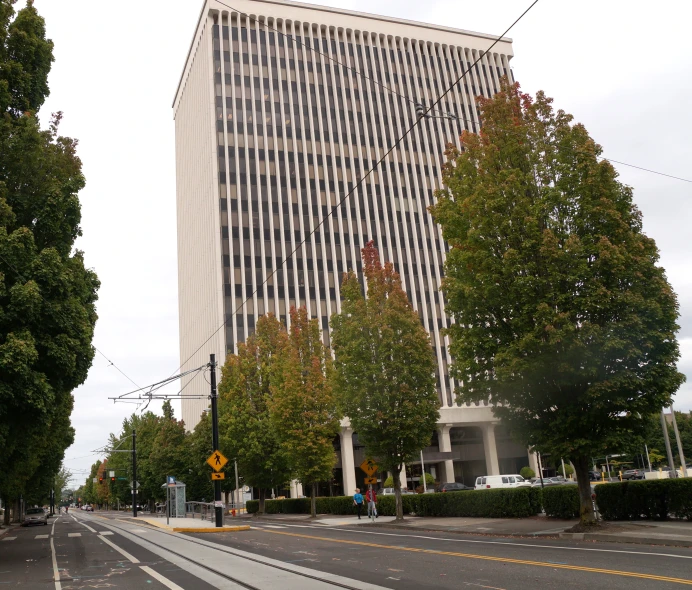 a very tall white and tan building with a lot of windows