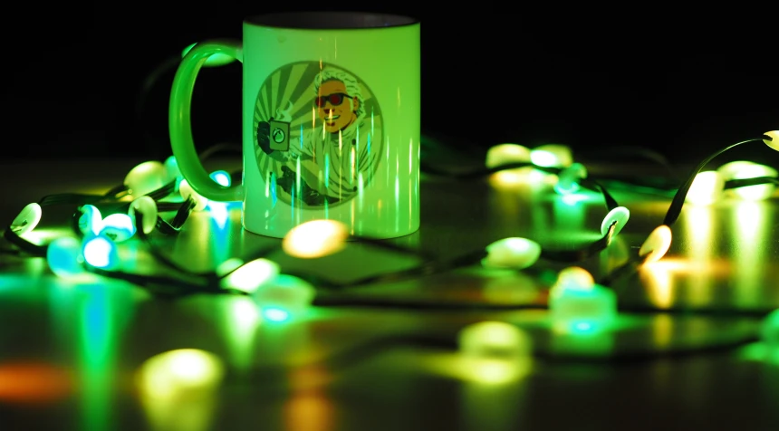 a coffee cup surrounded by christmas lights