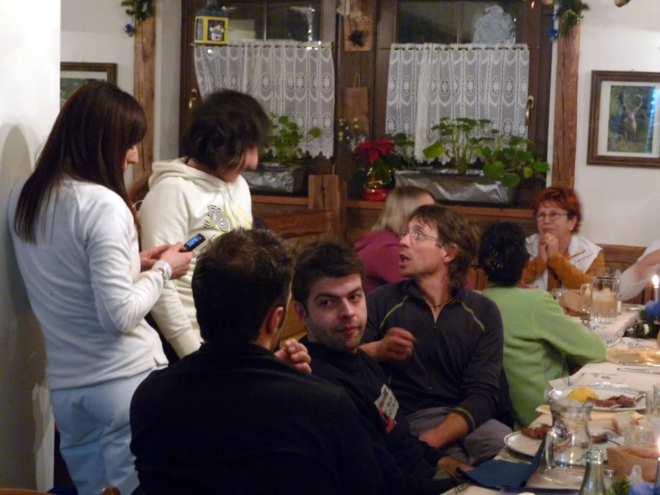several people sitting around at a table