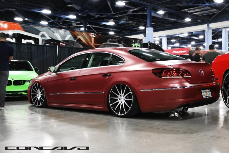 two cars that are sitting in a garage