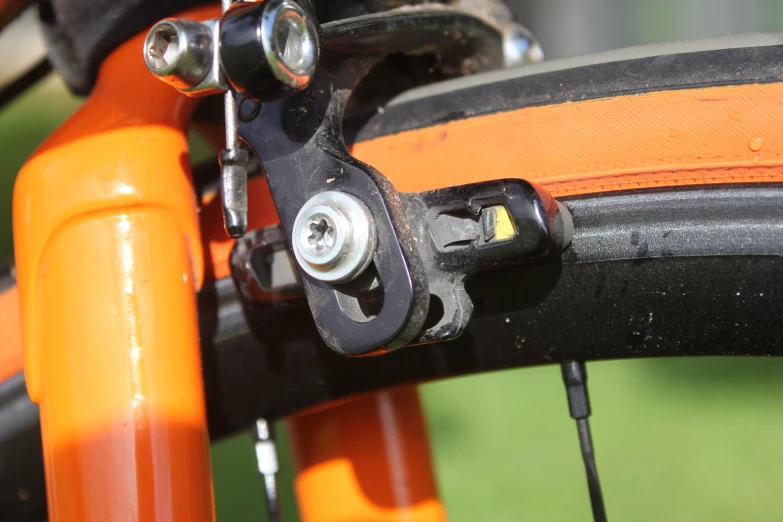 the ke of an orange bicycle