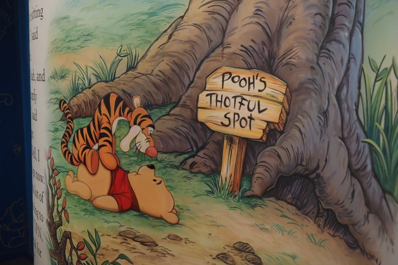 a close up of a cartoon book of winnie the pooh