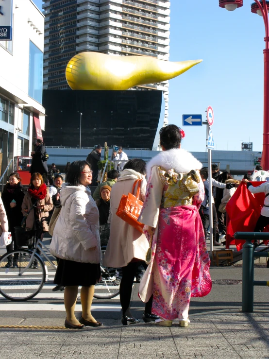 there is a man and woman standing on the street