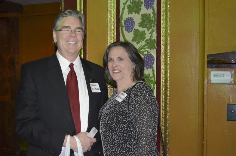 a man and a woman are posing for a picture