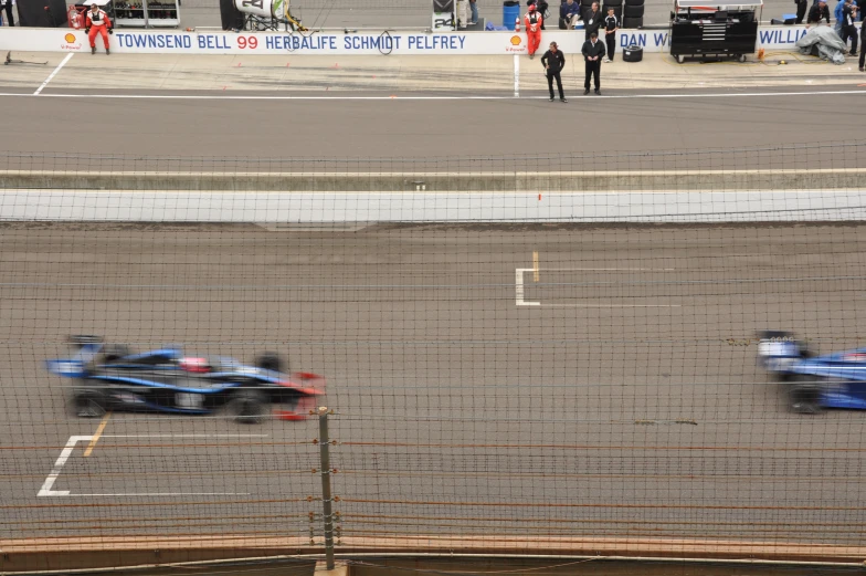 two racers driving through the track at a competitive race