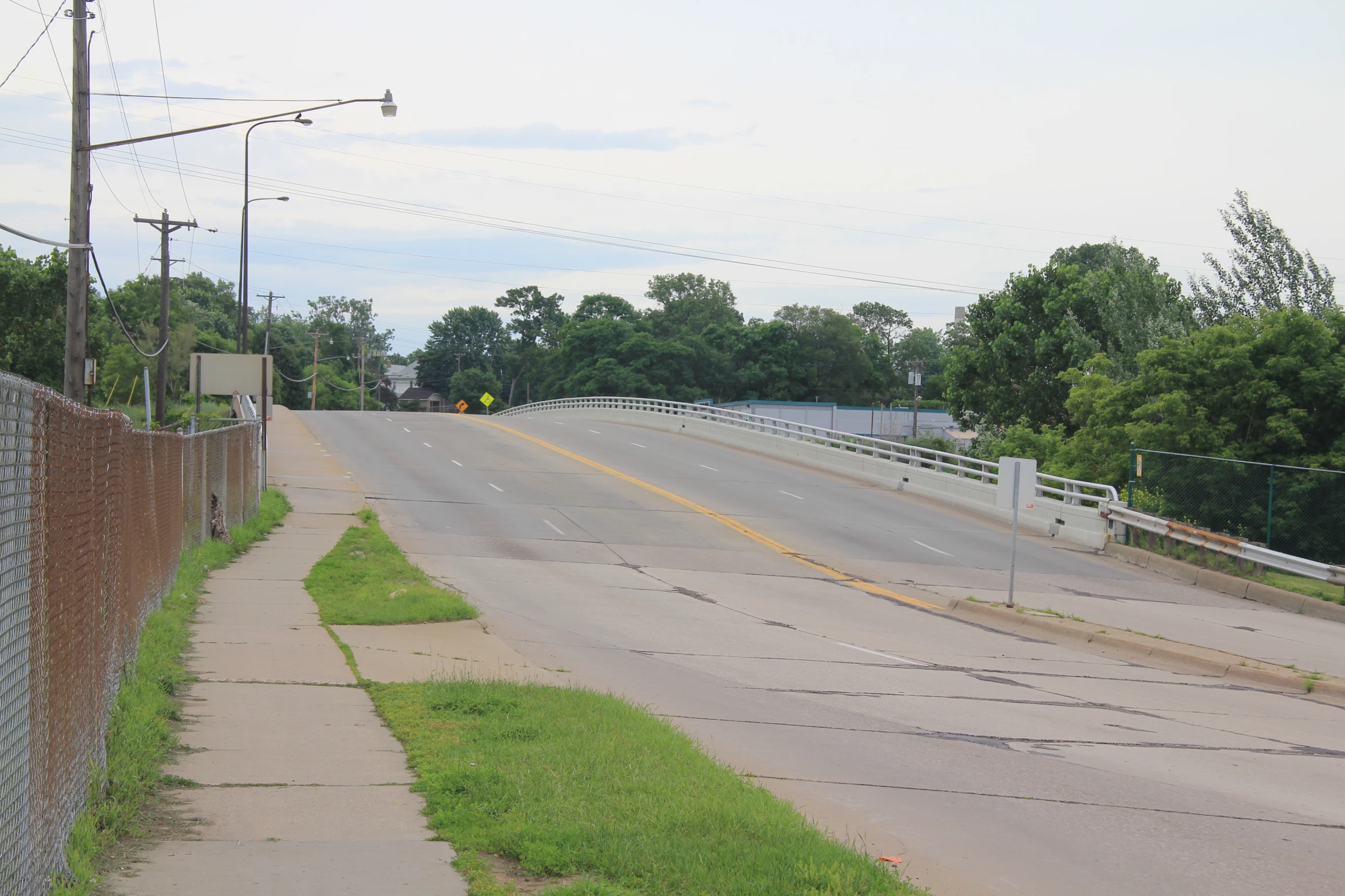 the road passes under the bridge on this side