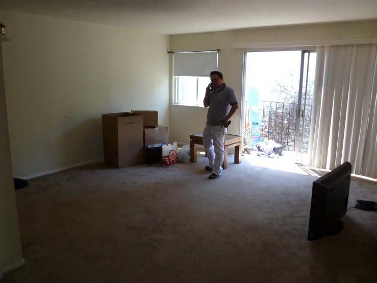 a man standing in front of a doorway in a living room