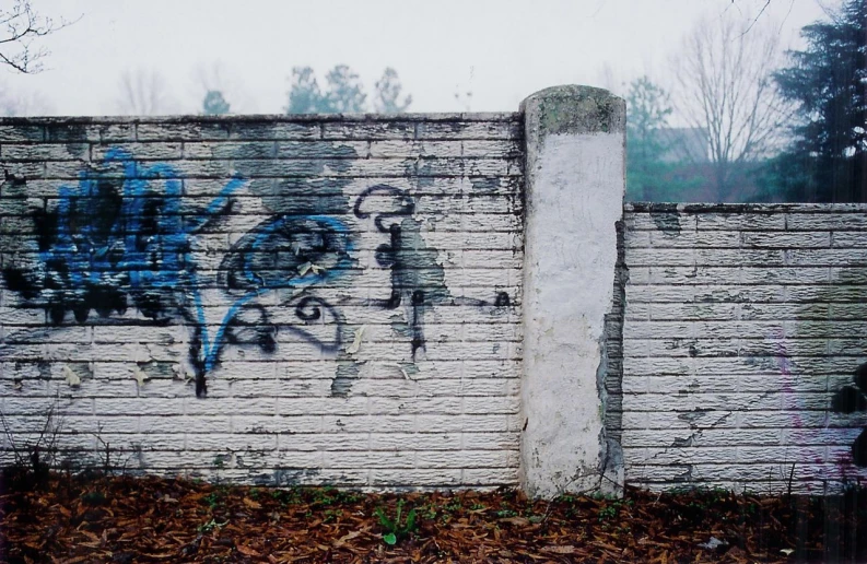 a wall that is painted with some graffiti on it