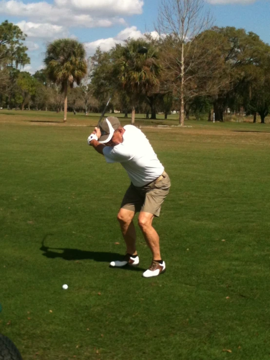 a man about to hit a ball in the air