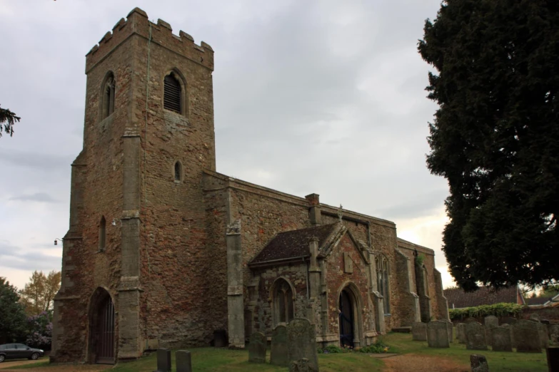 an old church sits on a quiet cemetery