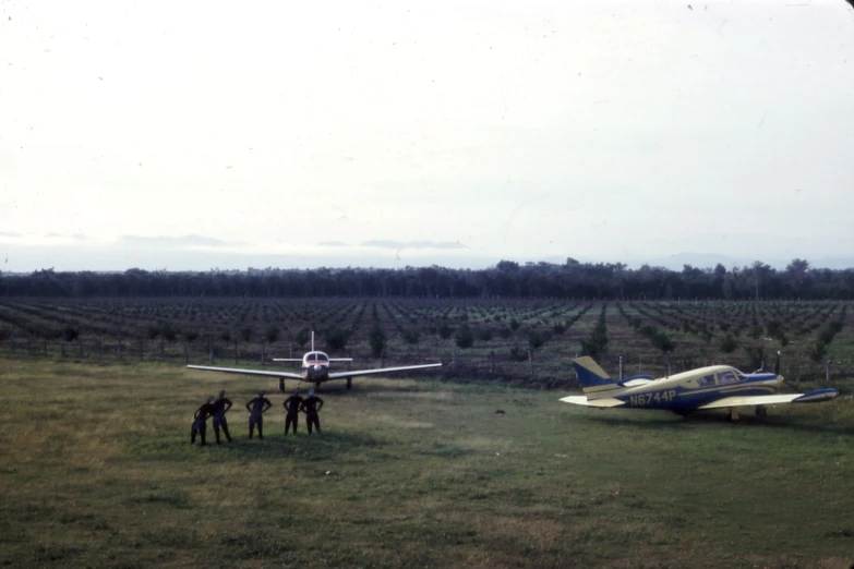 three small planes are out in the field