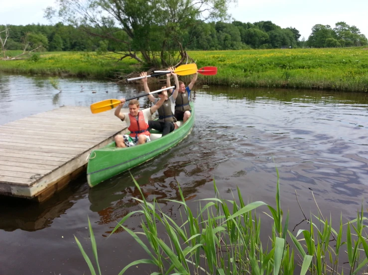 two people are paddling in a canoe