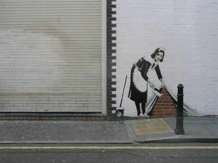 a large mural with a woman cleaning the street