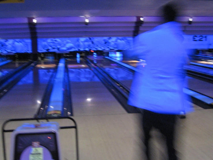 the bowling alley has bowling lanes and lights