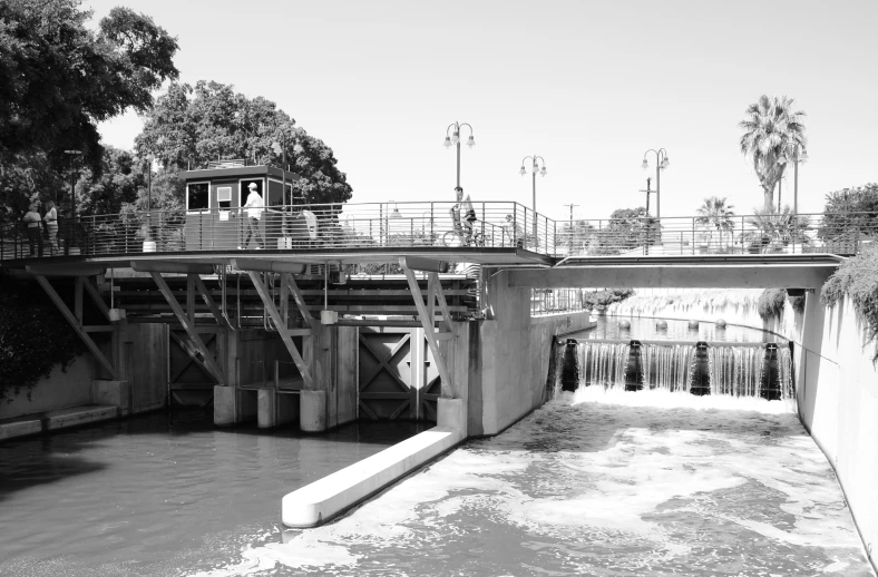 a boat going down a river with stairs and railings