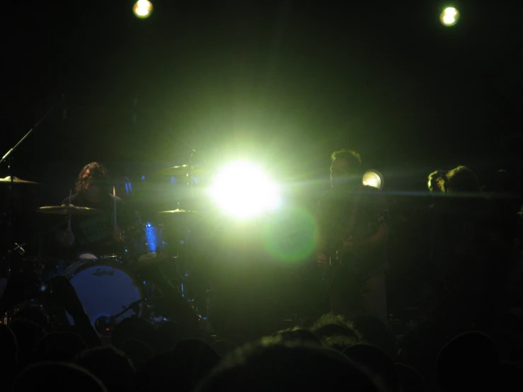 a group of people that are standing on a stage