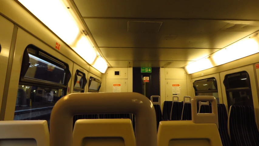 a picture looking down an empty train car at the inside