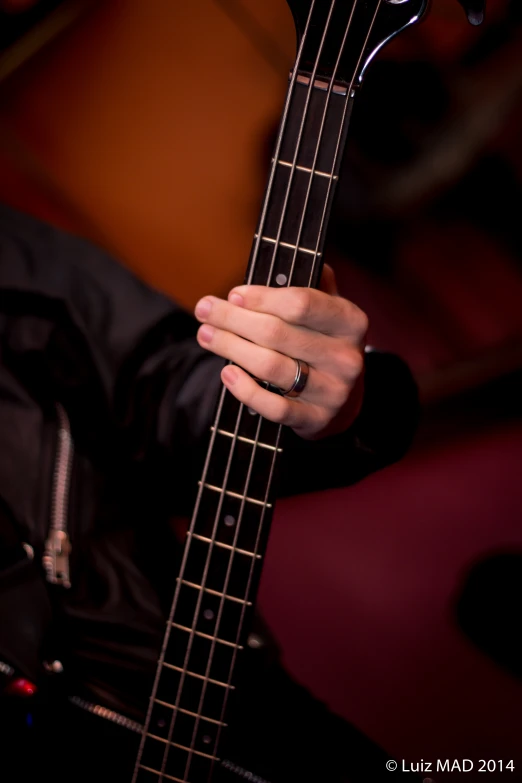 a close - up of a person holding a guitar