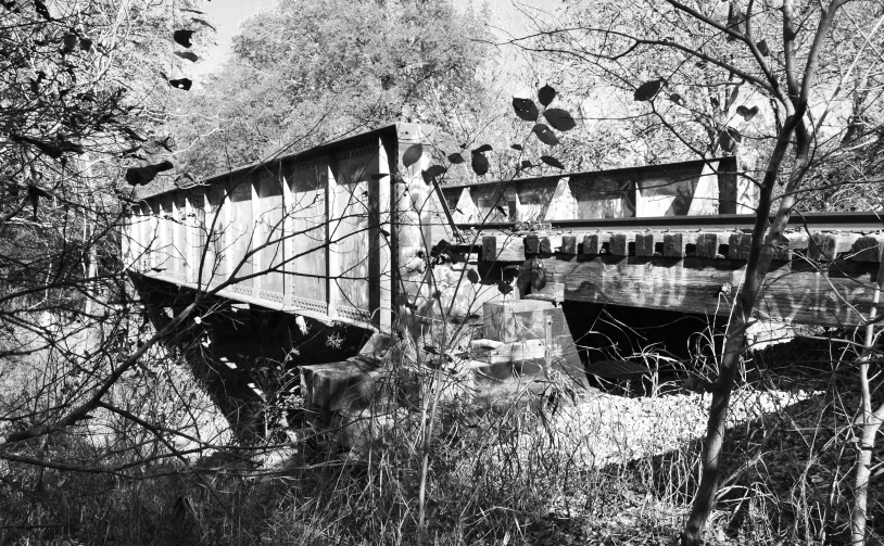 an old train car with broken windows and broken paint