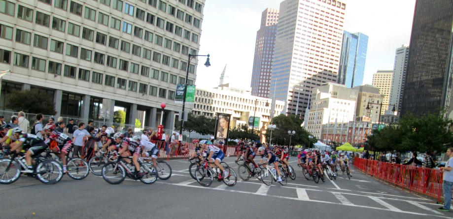 a large group of people riding bikes in a city