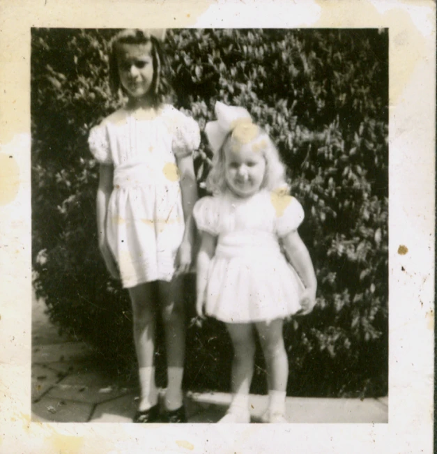 black and white pograph of two children with blonde hair