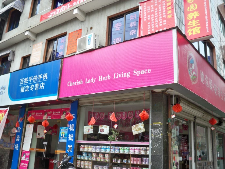 an asian convenience store and a chinese store on a corner