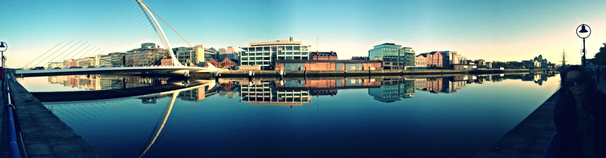 an image of some buildings and water on a sunny day