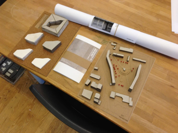 some shapes and materials are displayed on a table