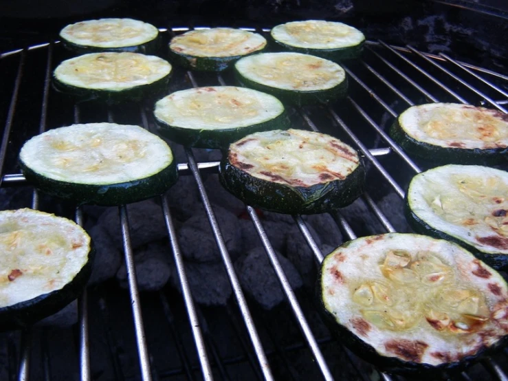 grilled food items being cooked over an outdoor grill