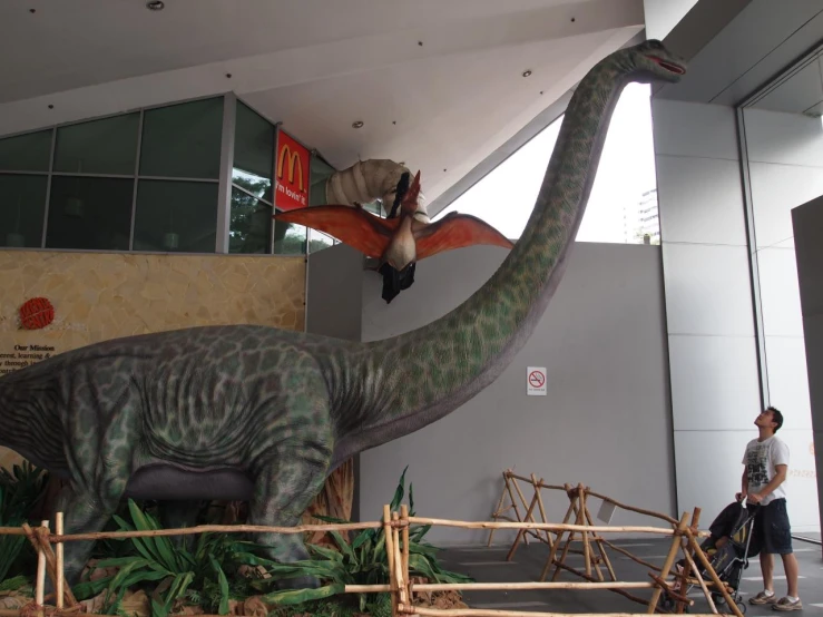 there are dinosaurs in the front of a building