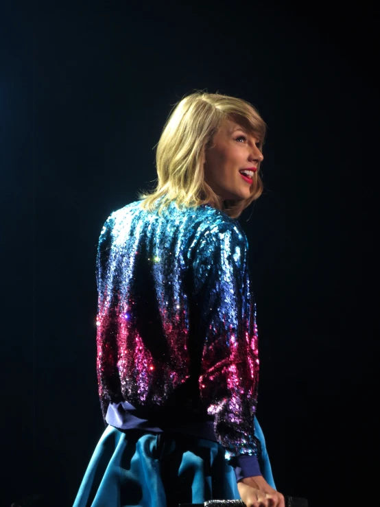 taylor swift's sequin jacket and blue skirt, performing at the 2018 cmt music awards