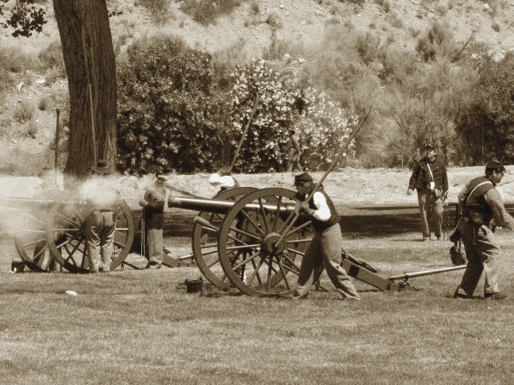 an old pograph of some men working on a old cart