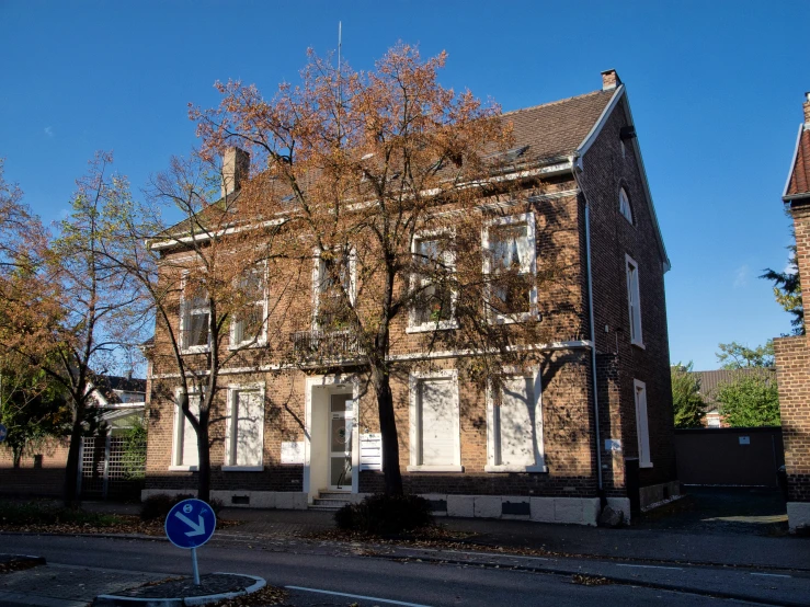 an old brick building on a quiet street corner