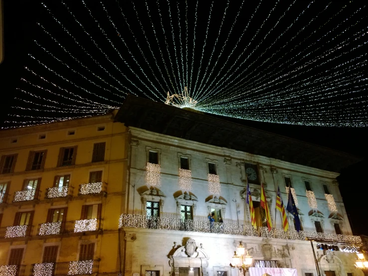 a city building with christmas lights and decorations