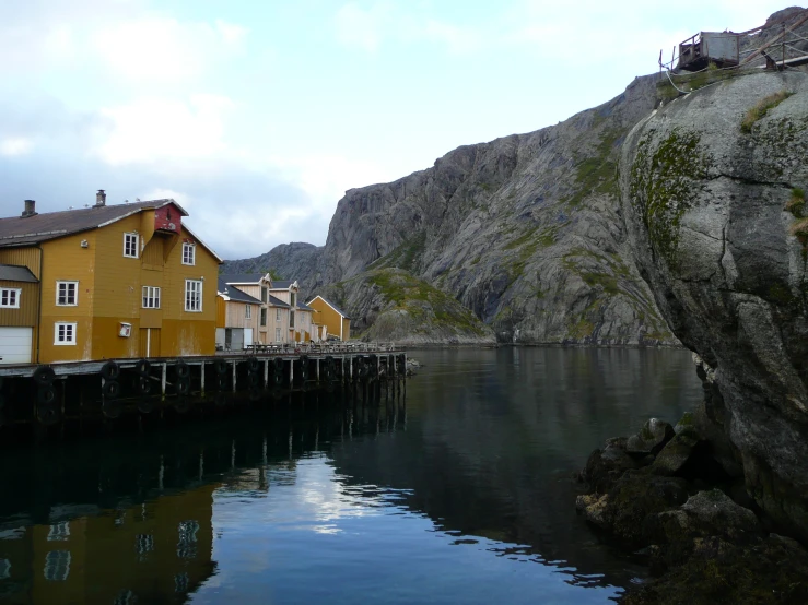 an image of a dock that is surrounded by buildings