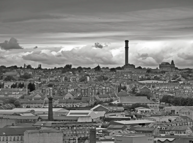 a large building with a smoke stack above