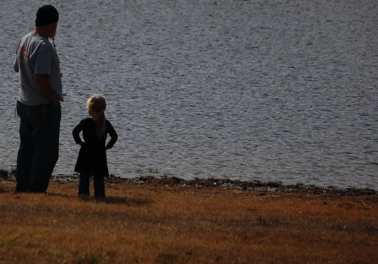 a man and a young child standing next to each other