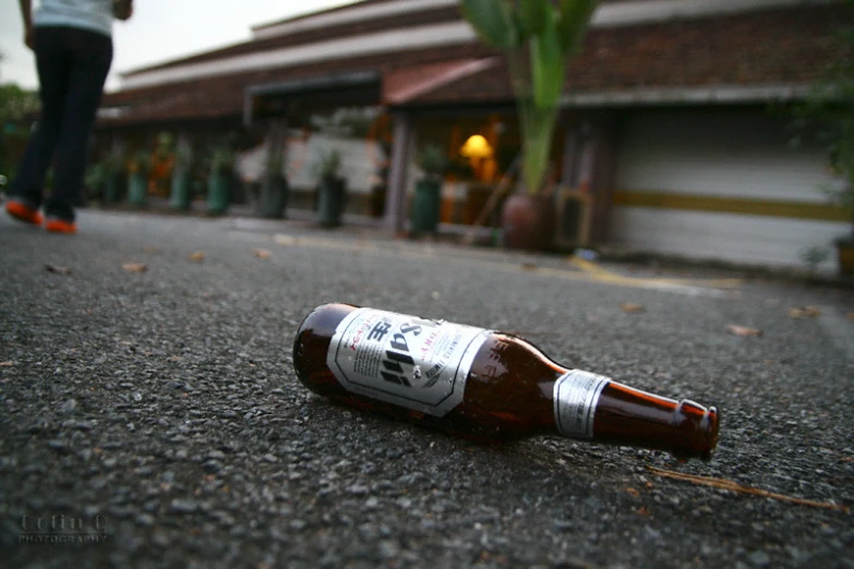 a beer that is sitting on the ground
