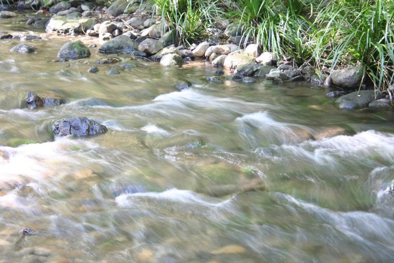 this is a river and rocks on the bank