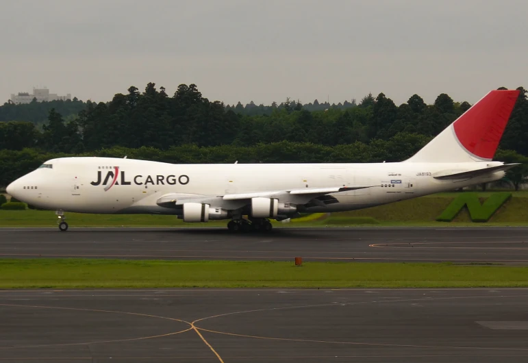 a large jetliner sitting on top of an airport tarmac