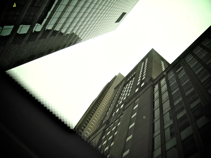 a very tall building is seen from the ground