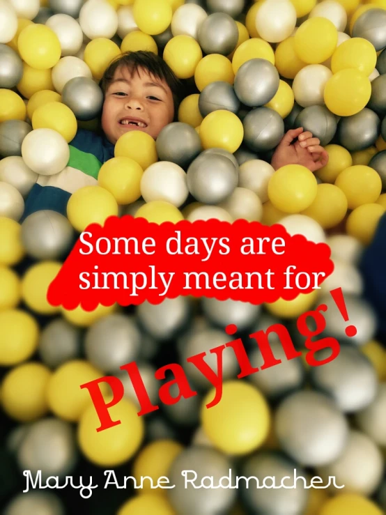 a  is surrounded by balls and text that reads, some days are simply meant for playing