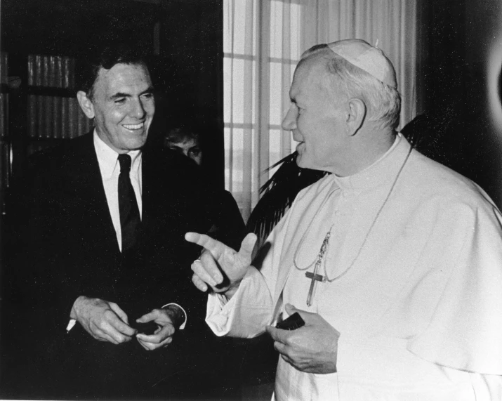 pope paul with another person holding soing up to the side