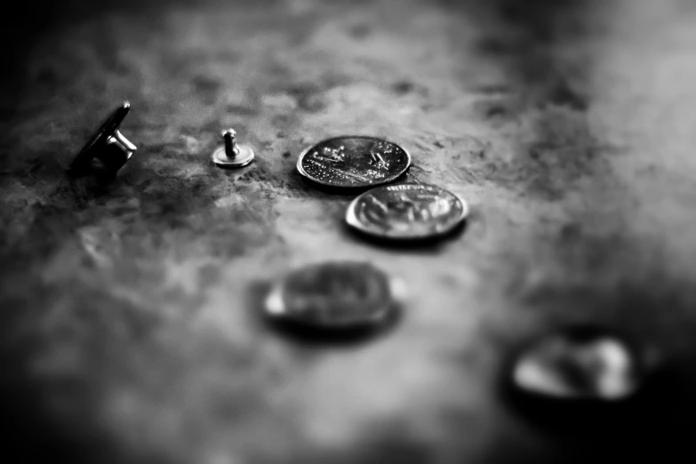 a couple of different types of tiny coins