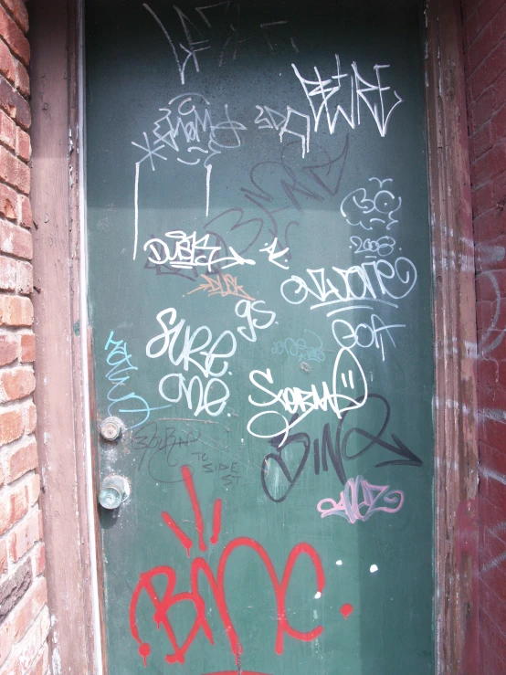 a door that has graffiti all over it