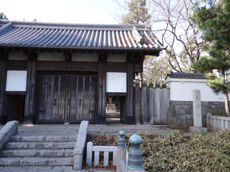 an old japanese shrine with wooden doors